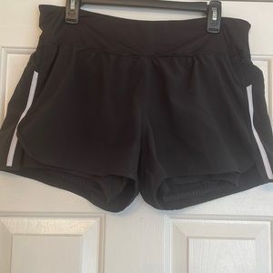 Champion workout shorts. Build in elastics shorts underneath. Sz- L slit in side
